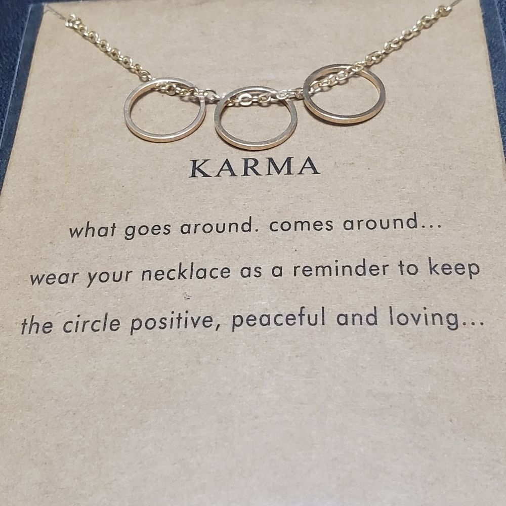 Gold tone karma necklace